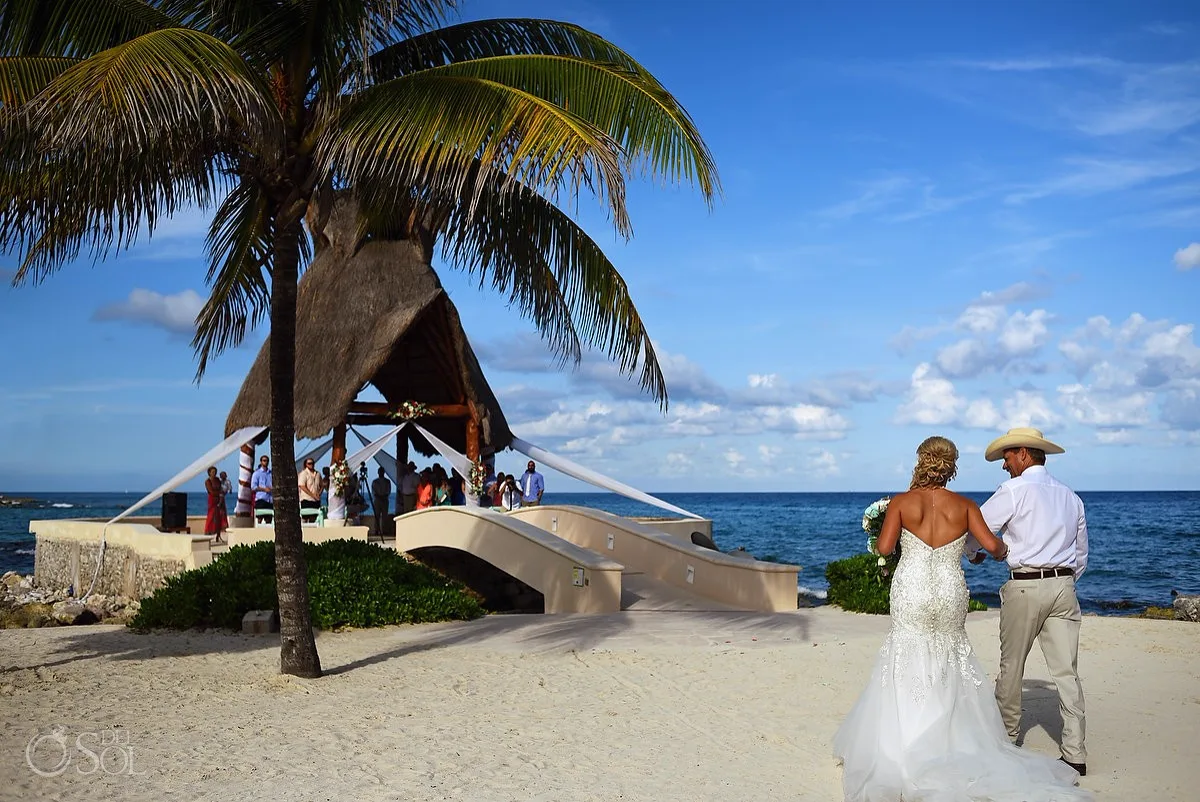 Bride walking to the oceanfront gazebo